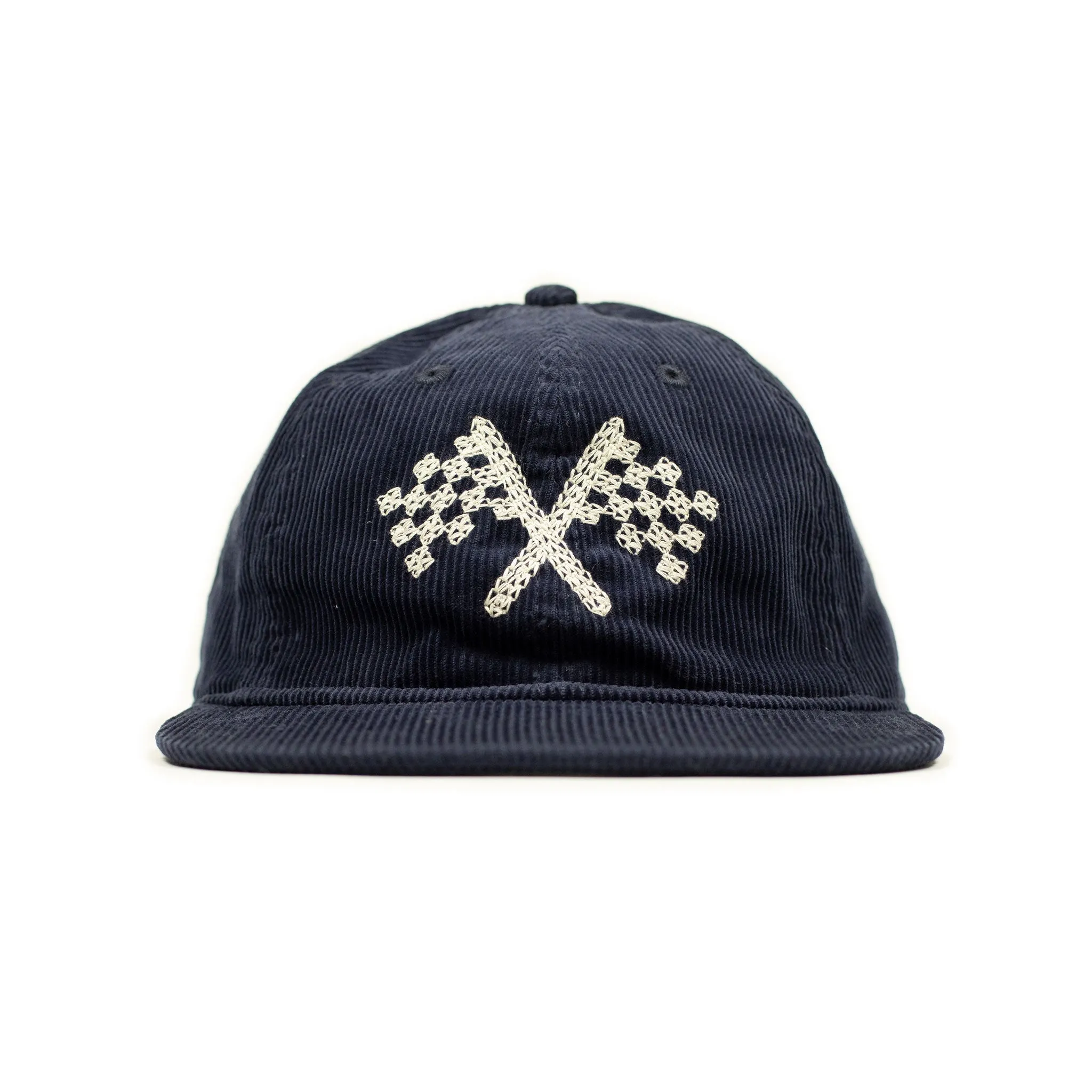 Corduroy cap in navy with racing flag chainstitched embroidery